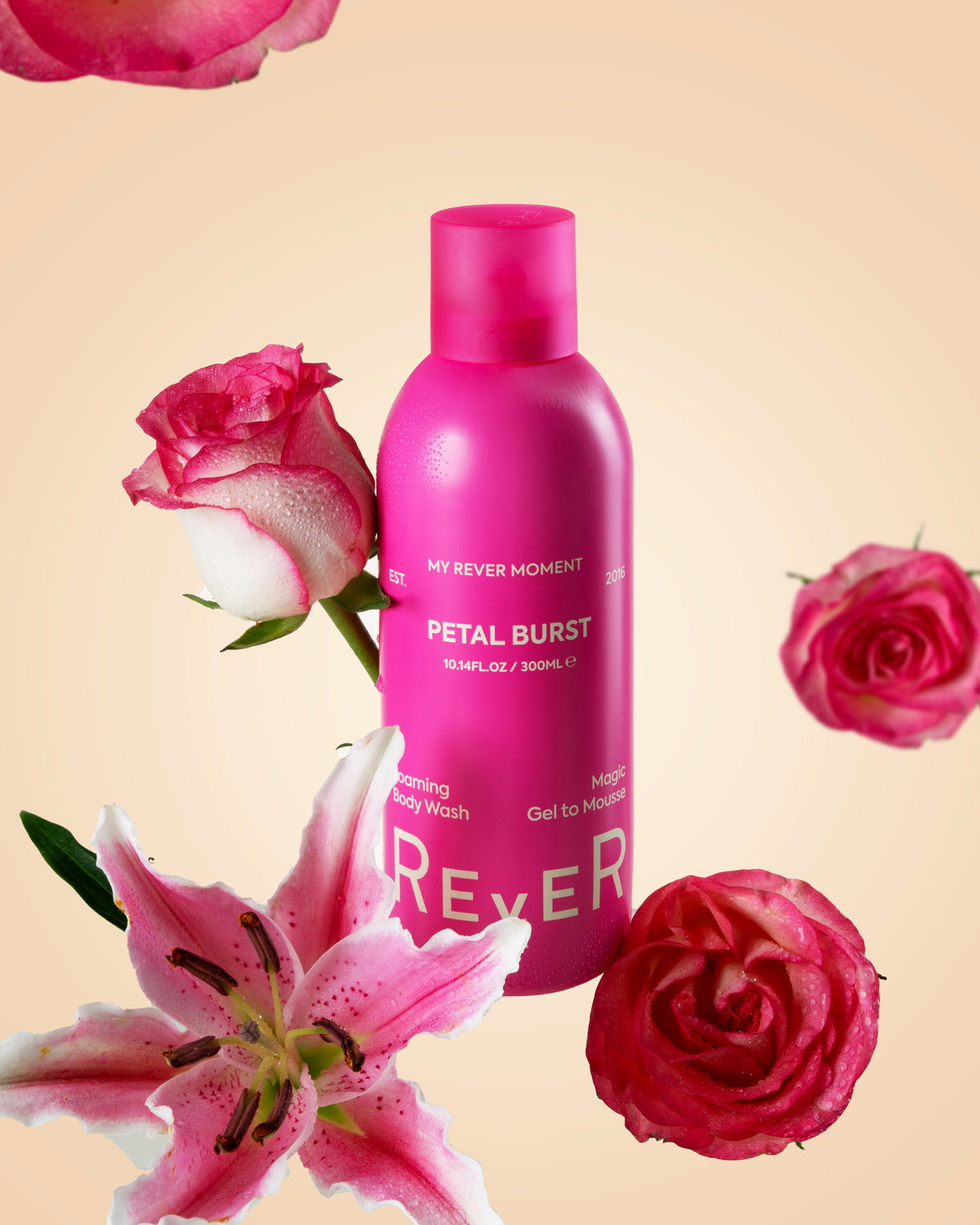 REVER Petal Burst foaming body wash styled with roses and lilies