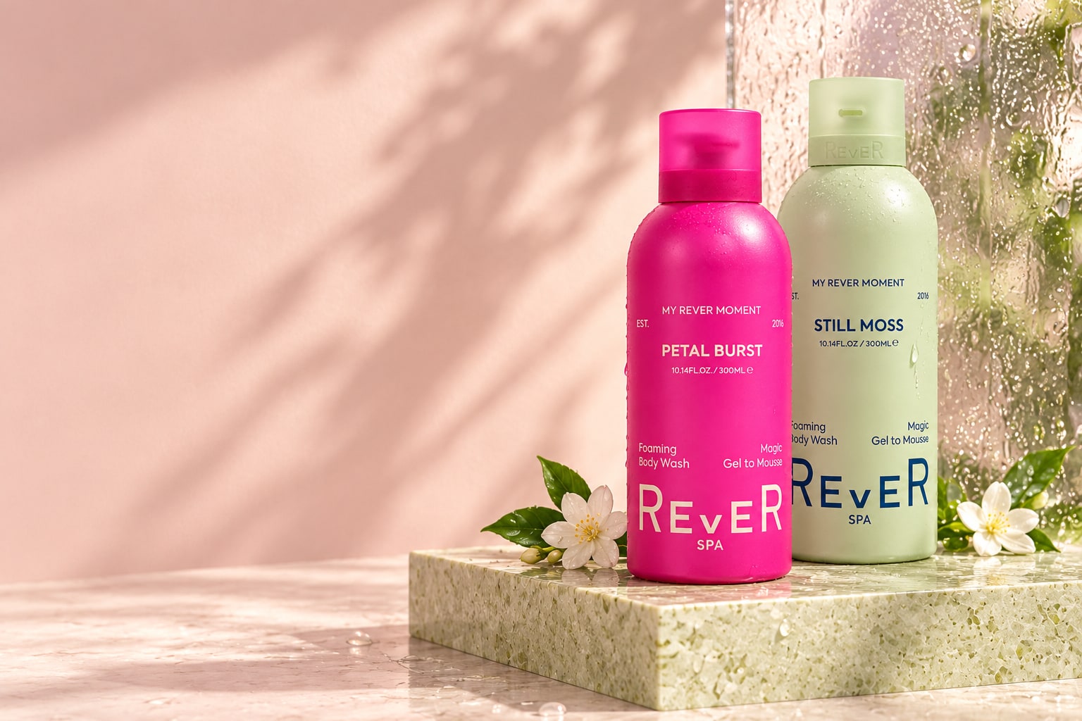Complete Petal Burst and Still Moss bottles in a sunlit REVER studio scene